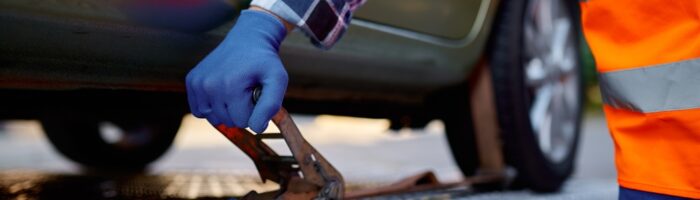 Closeup,Tow,Truck,Driver,Hand,Fixing,Car