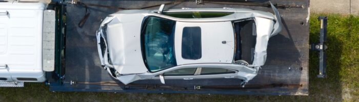 Tow,Truck,Hauling,Smashed,Vehicle,On,Car,Accident,Site.,Emergency